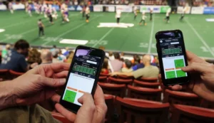 guys watching Football and placing bets at the same time